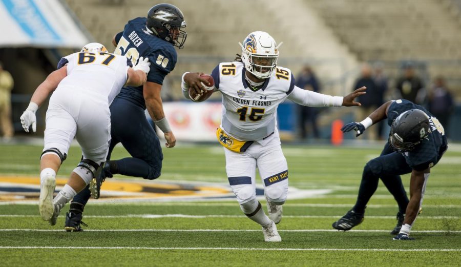 Kent quarterback Woody Barrett rushes the flashes matchup against Akron on Oct. 20, 2018. The Flashes lost, 24-23, in overtime.