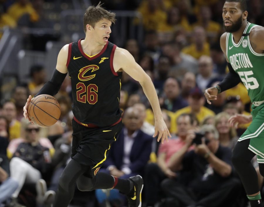 Cleveland Cavaliers Kyle Korver (26) looks past Boston Celtics Greg Monroe (55) in the second half of Game 3 of the NBA basketball Eastern Conference finals on May 19, 2018, in Cleveland. The Cavaliers won, 116-86. (AP Photo/Tony Dejak)