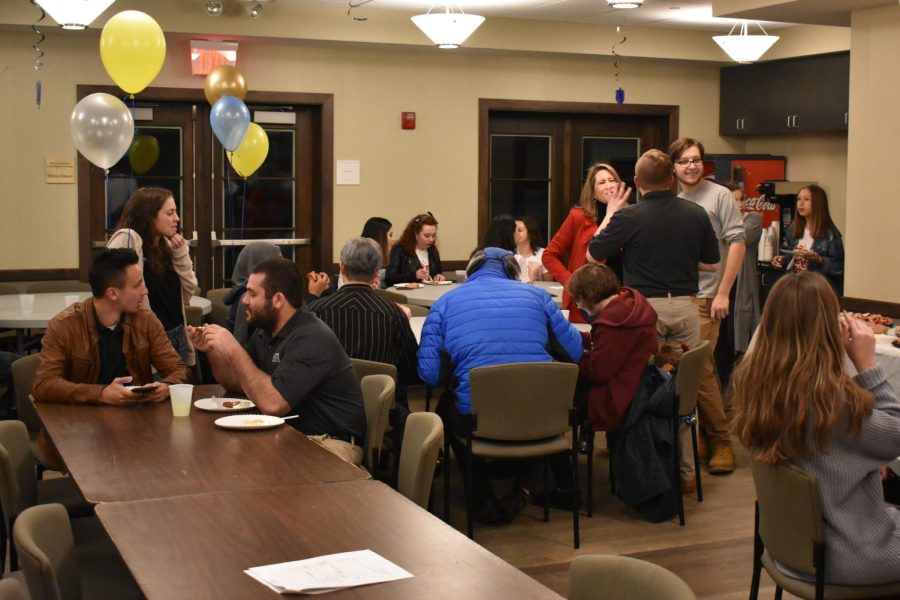 Members of the Jewish community enjoy latkes and doughnuts at a LatkeFest held at the Hillel Center hosted by Alpha Epsilon Pi on Nov. 29, 2018.