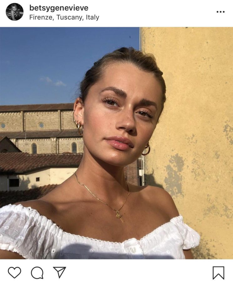 Betsy Garwood, a brand representative for skincare and makeup company Glossier and a senior visual communication design major, poses for a photo in Florence, Italy, on May 31, 2018. Glossier posted Garwoods photo because she was wearing Last Slick, its mascara. 