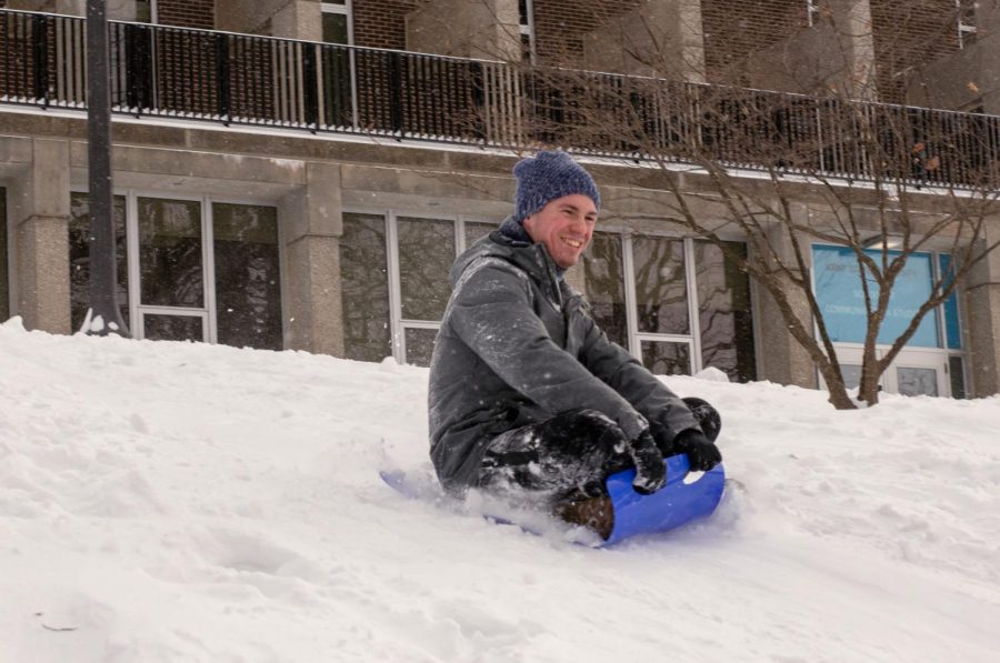 Collin Werner, a junior computer science major, sleds down Blanket Hill near Taylor Hall Sunday, Jan. 20, 2019.