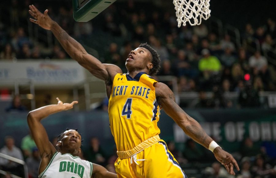 Kent States Antonio Williams reaches for the ball during the match against Ohio University on Tuesday, January 15, 2019.