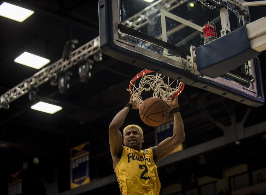 Kent State freshman forward BJ Duling dunks off a pass from Jaylin Walker in the Flashes 64-63 win over Bowling Green on Feb. 24, 2018, at the M.A.C. Center. Both of Dulings baskets were dunks. 