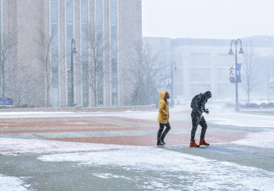 Students walk across Risman Plaza on Kent States main campus and battle the frigid cold on Tuesday, Jan. 29, 2019.