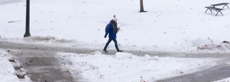 A Kent State student walks along Kent States front campus on Tuesday, Jan. 29, 2019.