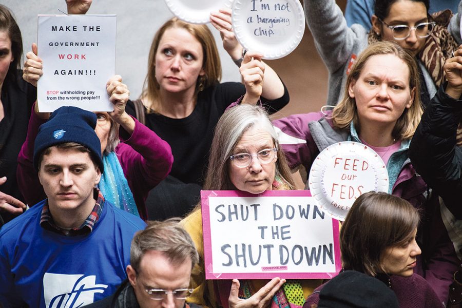 Federal workers and contractors, along with their unions, stage a protest calling for and end to the government shutdown and back pay in the Hart Senate Office Building in Washington D.C. on Wednesday, Jan. 23, 2019. (Photo By Bill Clark/CQ Roll Call via AP Images)