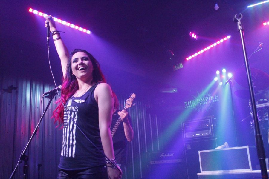 Dakota Wilkinson, lead singer of rock band Flight 619, cheers on the crowd.