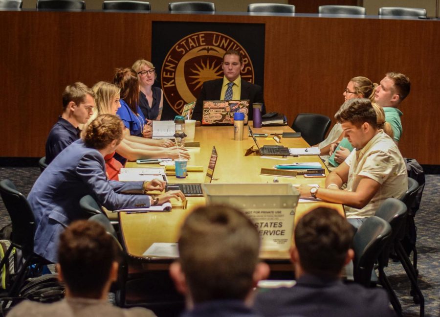 Kent State Undergraduate Student Government representatives and senators go over their reports and discuss meal plan changes in their first meeting of the semester Wednesday, Aug. 29, 2018, in the Governance Chambers.