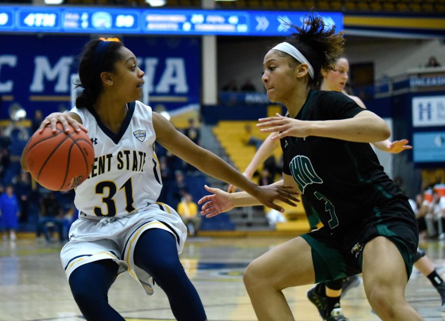 Junior Megan Carter dribbles during the second half of Kent States matchup against Ohio University on Feb. 23 2019. Kent State lost, 69-67.