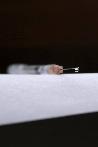 A disposable syringe lying on a table Nov. 21, 2018. 
