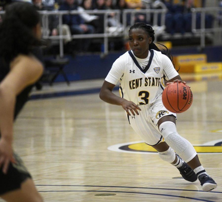 Kent State freshman guard Asiah Dingle dribbles down the court during a game against Oakland University Nov. 18, 2018. Kent State won the game 75-65.