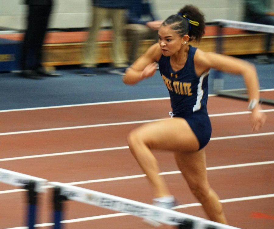 MiAngel Daniels vaults herself over the hurdle in the 60-meter hurdles during the Doug Raymond national qualifier held at the Kent State Fieldhouse. Daniels finished seventh in the finals of the event.