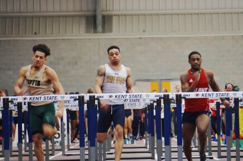 Junior Dairius Ragland prepares to jump over the hurdle during the 60 meter hurdles at the Kent State Tune Up on Saturday. Ragland finished fifth with a time of 8.35 seconds. 