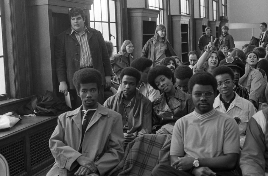 Students gather on campus to listen to university administration in 1970.