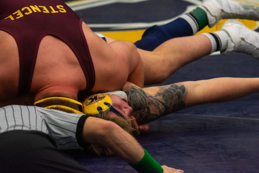 Spencer Berthold gets pinned during the Beauty and Beast Match on Sunday, Feb. 10, 2019. The Flashes lost, 23-12.