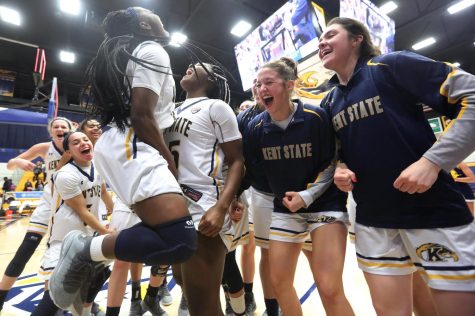 Members of the Kent State womens basketball team celebrate after the Flashes 67-58 win over Miami (OH) on Feb. 27. 