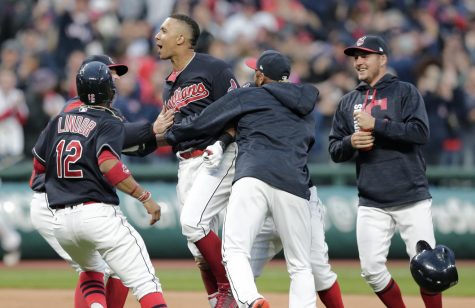 Cleveland Indians Michael Brantley is mobbed by teammates after Brantley hit a one run double off Chicago White Sox relief pitcher Tommy Kahnle in the tenth inning of a baseball game, Tuesday, April 11, 2017, during opening day in Cleveland. Lindor scored on the play. The Indians won 2-1 in 10o innings.