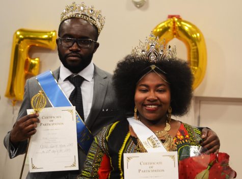Mike Esekwen and Katia Roberts pose together after winning king and queen of the Face of Africa pageant Friday, Oct. 27, 2017. 