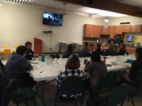 Soup and Scripture attendees watch a video during the first event Wednesday, Feb. 6.