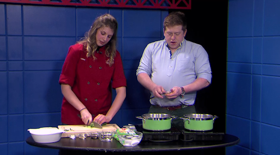Ashley Foster, President of Chefology, shows host, Connor Hren how to make elevated ramen.