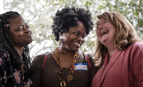 (LEFT TO RIGHT) Angela Clyburn, Jennifer Clyburn Reed and Schultz share a laugh during the Dorchester County Democrats first annual oyster roast in Summerville, South Carolina, Saturday, March 2, 2019.