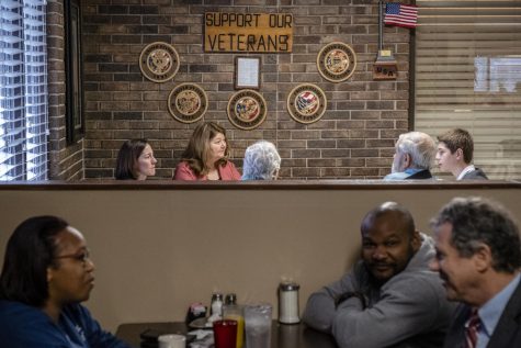Schultz and Brown (front right) talk with diners during breakfast at Brazens Family Restaurant in Florence, South Carolina, Saturday, March 2, 2019.