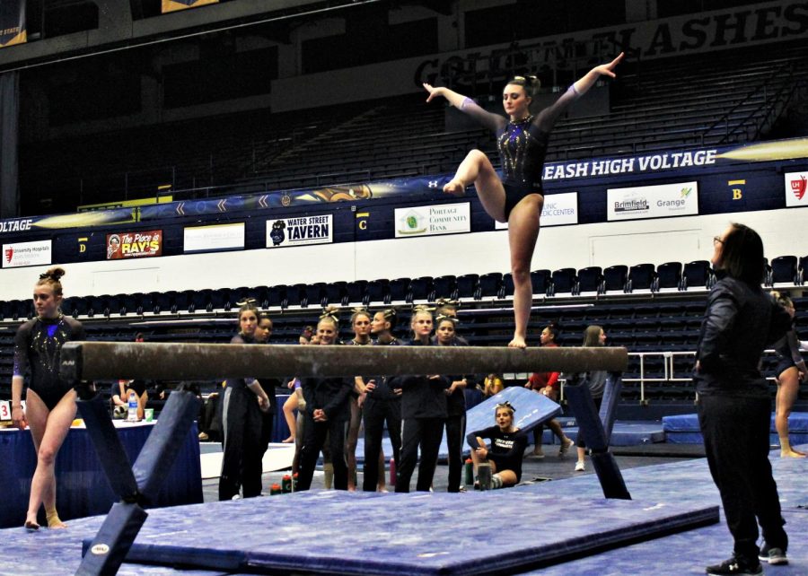 Freshman Madison Iannuzzo serves the audience with a beam performance on Feb. 24, 2019.   