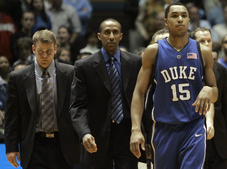 Dukes Gerald Henderson (15) leaves the court after being ejected for a flagrant foul on North Carolinas Tyler Hansbrough during the second half of a college basketball game in Chapel Hill, N.C., Sunday, March 4, 2007. North Carolina won, 86-72. From left are assistant coaches Steve Wojciechowski and Johnny Dawkins.