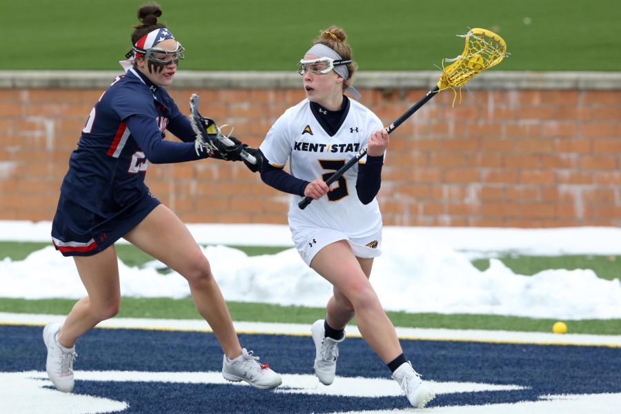 Kent State midfielder Clarie Welter looks to pass against Robert Morris on Feb. 16. Kent State lost, 11-6.