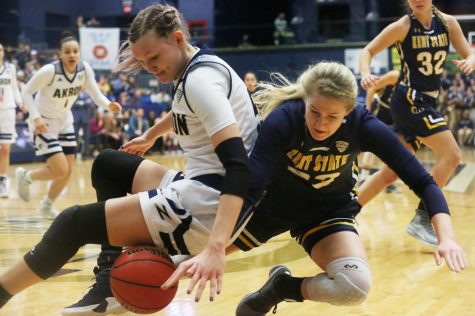 Ali Poole dives for the ball during the second half of Kent States game against Akron on March 6. The Flashes won, 65-55. 