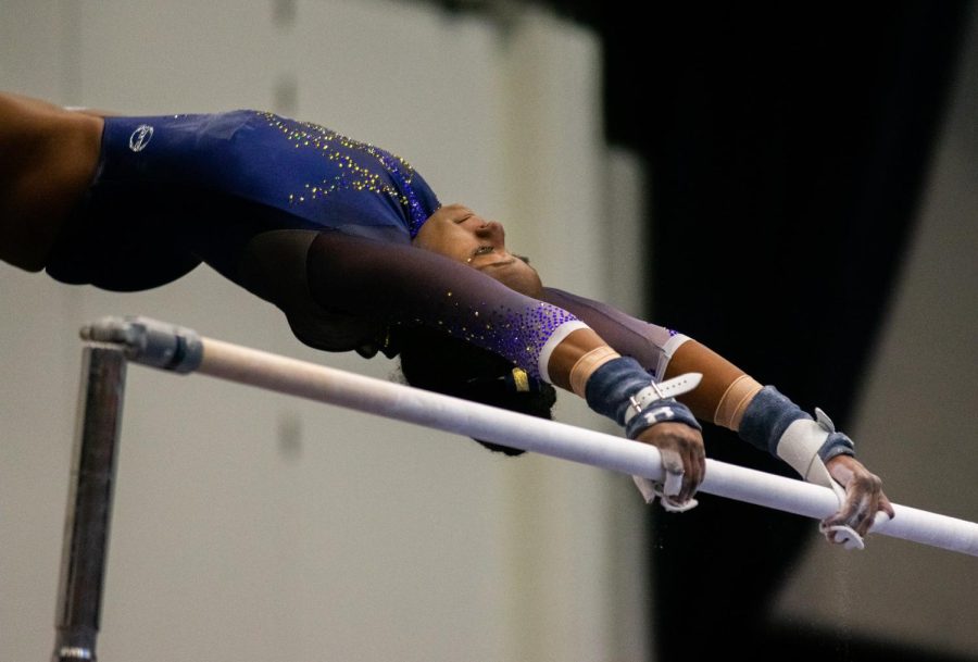 Toshi Richards on the uneven bars at the Beauty and the Beast match on February 10, 2019.
