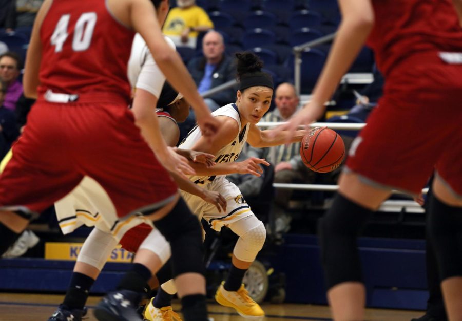 Then-sophomore point guard Alexa Golden dribbles past the Miami (OH) defense in a game at the M.A.C. Center Feb. 1, 2017. The Golden Flashes won 84-66.