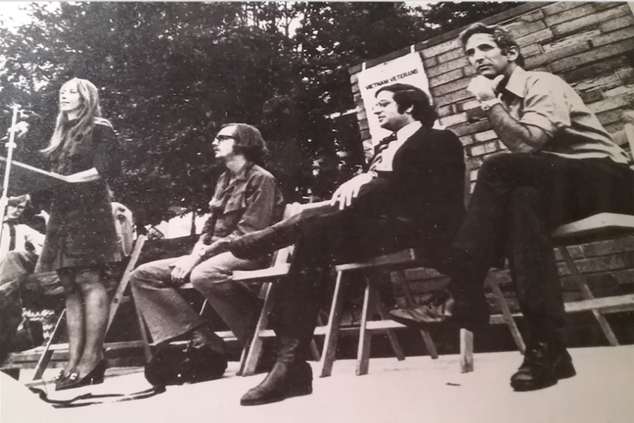 Barbara Child speaks at an anti-war rally on the Kent State University Commons in 1972 with Alan Moris (center left).