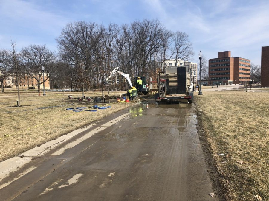 Maintenance workers near Manchaster Field repair a water line break on campus Friday, March 8, 2019.