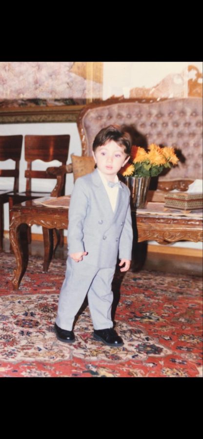 Vala Zeinali in a suit as a child in Iran.