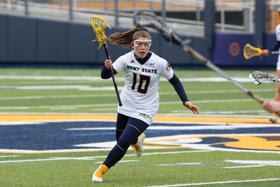 Kent State midfielder Madison Rapier carries the ball up against Robert Morris. The Colonials won, 11-6.