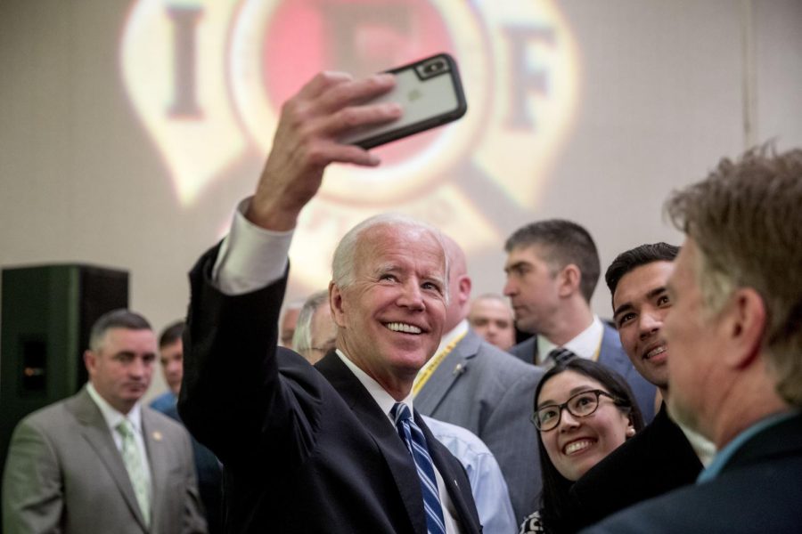 Former Vice President Joe Biden takes a photograph with members of the audience after speaking to the International Association of Firefighters at the Hyatt Regency on Capitol Hill in Washington, Tuesday, March 12, 2019, amid growing expectations hell soon announce hes running for president. (AP Photo/Andrew Harnik)
