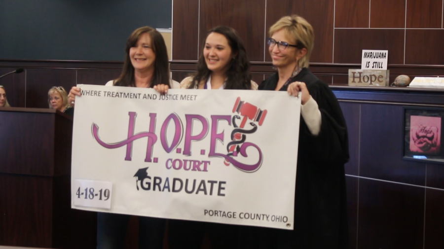 Portage County Common Pleas Judge Becky Doherty poses for a photo with H.O.P.E. graduates. 