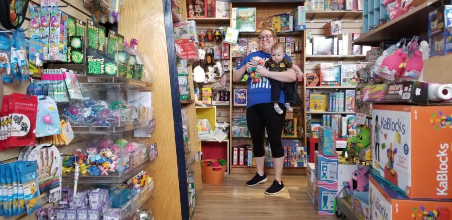 Kayla Sellers and her son, Lennon, 6 months, shop inside the Off the Wagon toy section in downtown Kent on Wednesday, April 17, 2019. Sellers is from Rootstown.