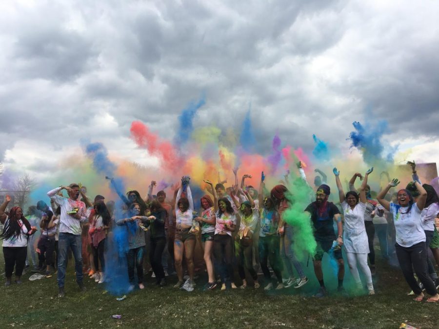 Students throw colorful powder in the air as they celebrate Holi April 6. 