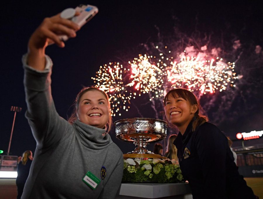 Michela Finna and Pimnipa Panthong take a selfie as they watch fireworks before the start of the Augusta Womens Championship.