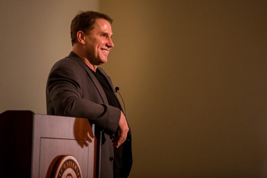 Author Nicholas Sparks stands at the podium at Kent State Stark campus on Wednesday, April 17, 2019.