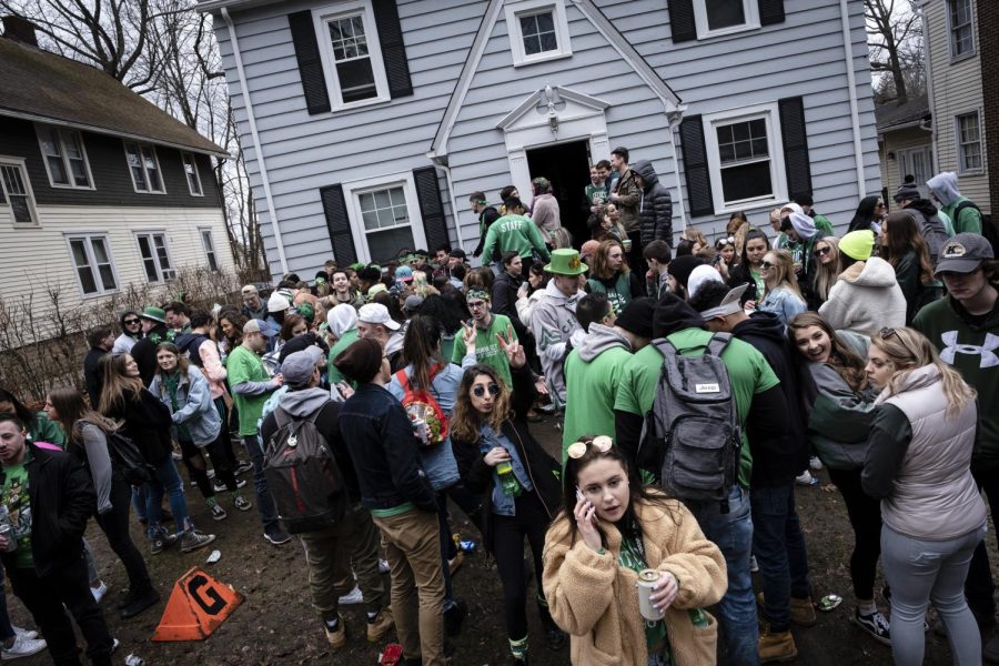 Partygoers+stand+outside+a+house+on+University+Drive+during+this+years+annual+Fake+Paddys+Day+celebration+in+Kent.
