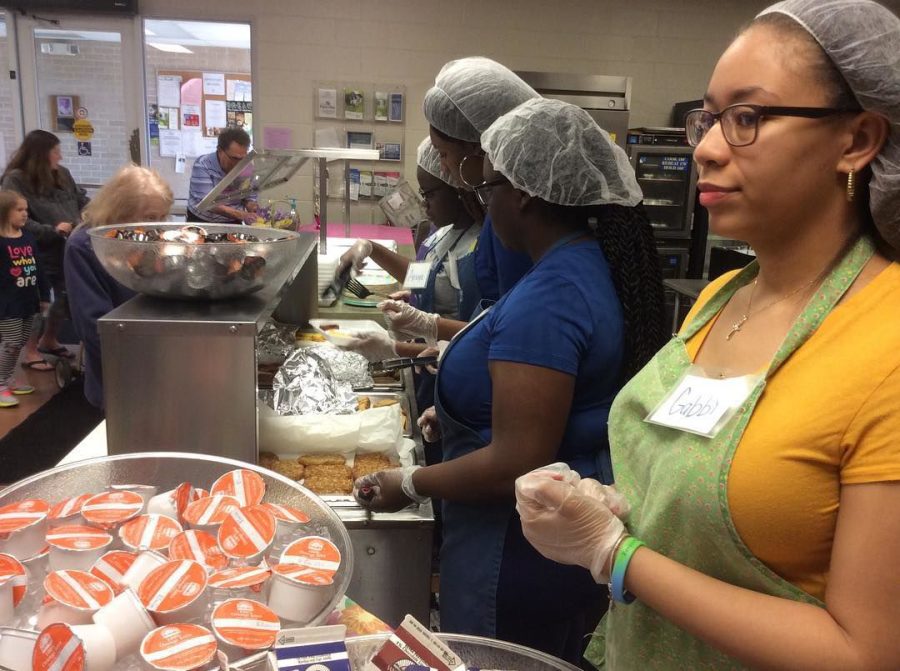 Members of The Reach Out serving breakfast at the Center of Hope in Ravenna Saturday, April 13.