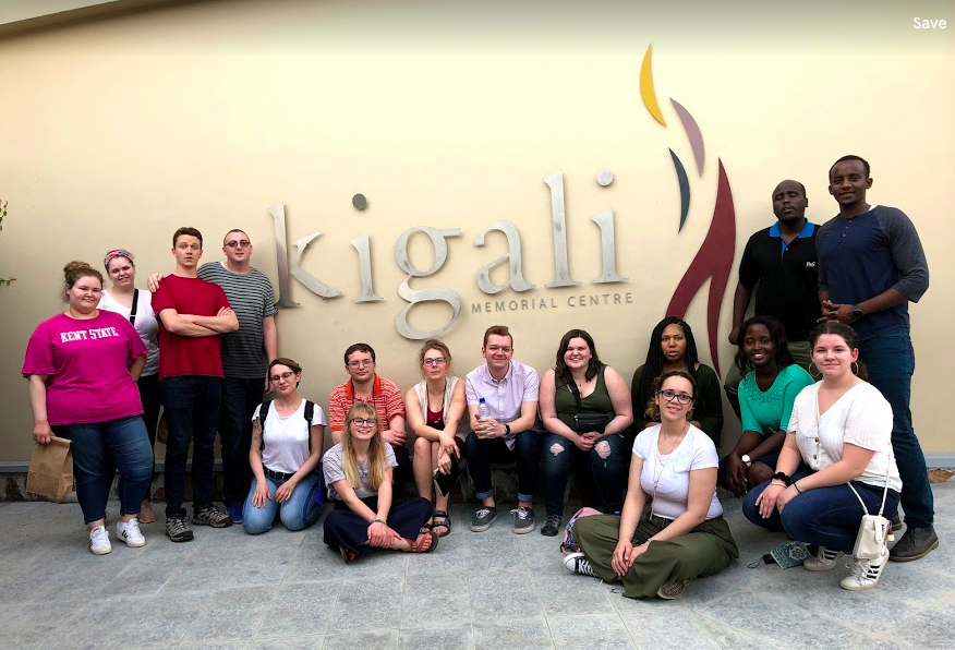 Students and faculty pose in front of the Kigali Genocide Memorial.