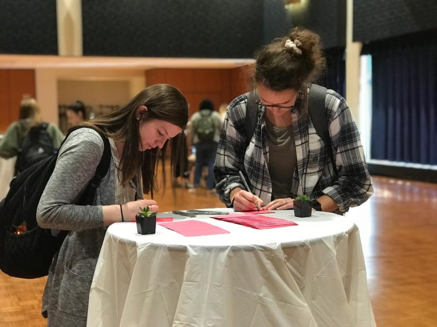 Freshman nursing students Jillian Pratt (left), and Caroline Girard (right) write letters of hope to patients in mental health facilities, Monday, April 22, 2019.