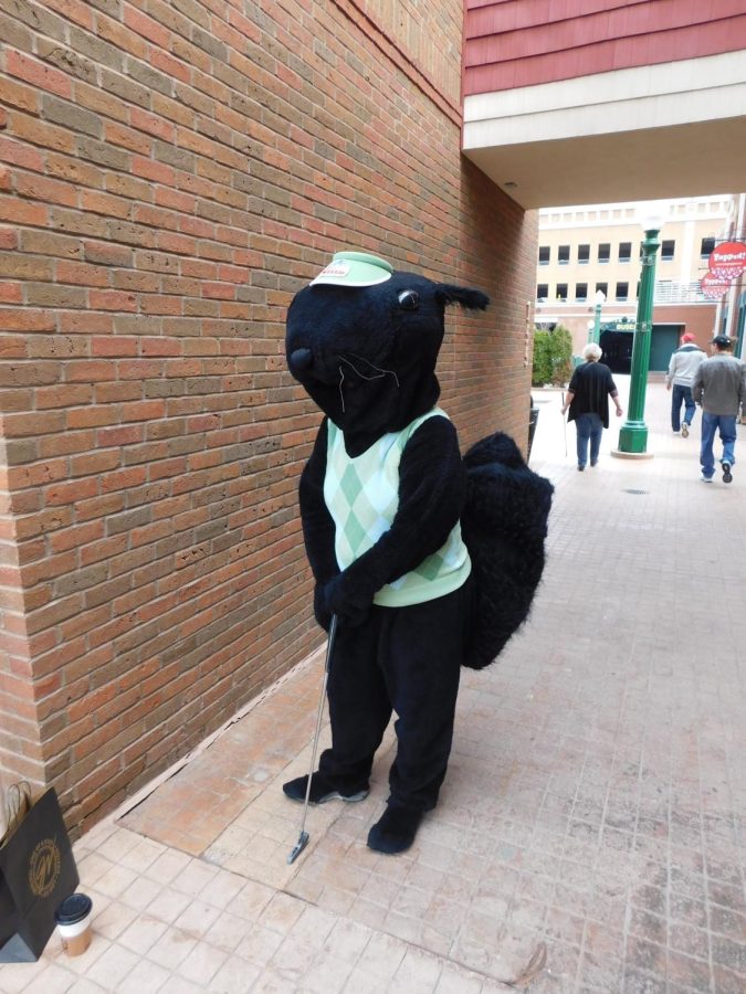 Someone dressed up as the Main Street Kent mascot black squirrel during the Putt Around Downtown event Saturday, April 6.