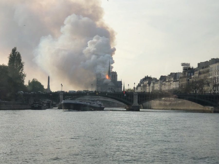 A photo captures the famed Notre Dame cathedral on fire.