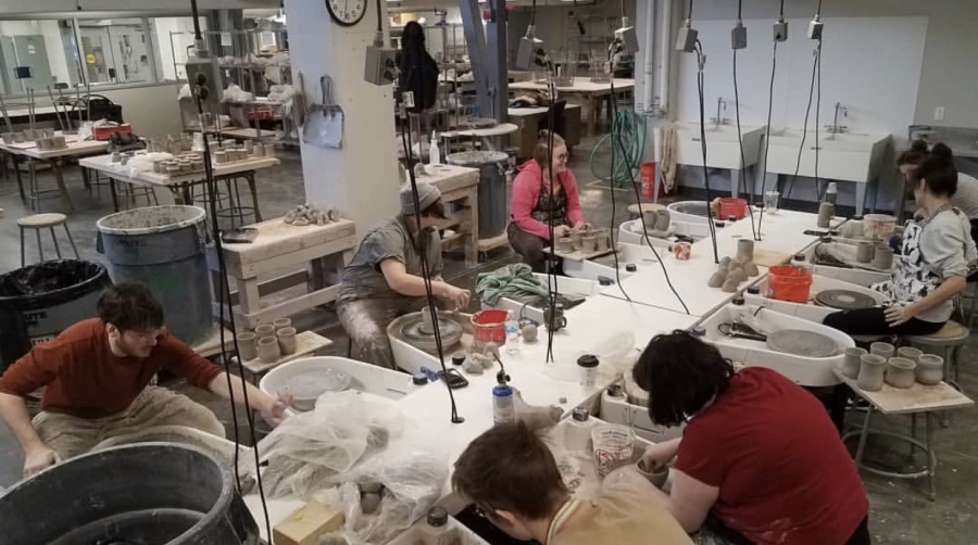 Students work on pieces in the ceramics area of the Center for Visual Arts.