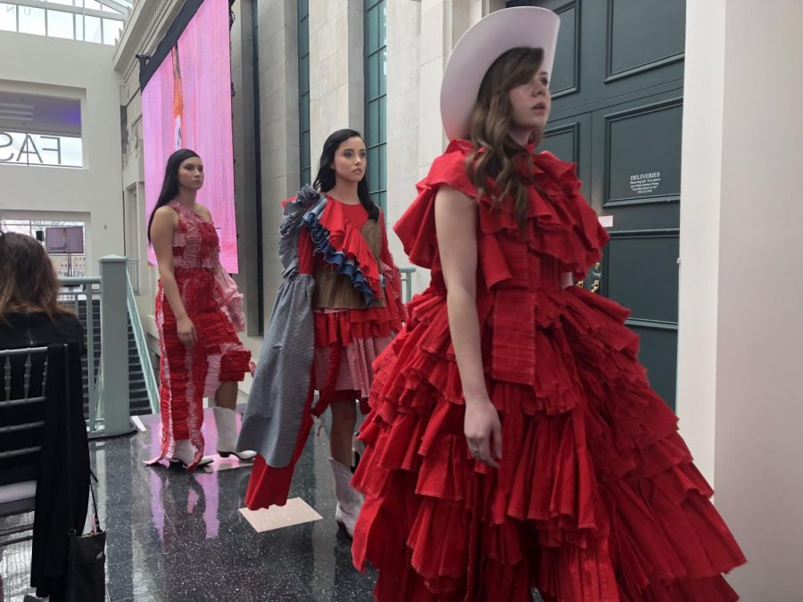 Models walk through the Rockwell Hall atrium in designer Tatum Reussers Scarlet Is She line on Friday, April 26, 2019.